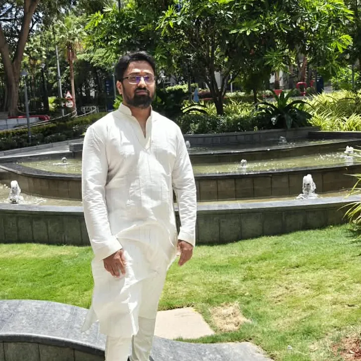 Pavan in a white kurta in a garden
